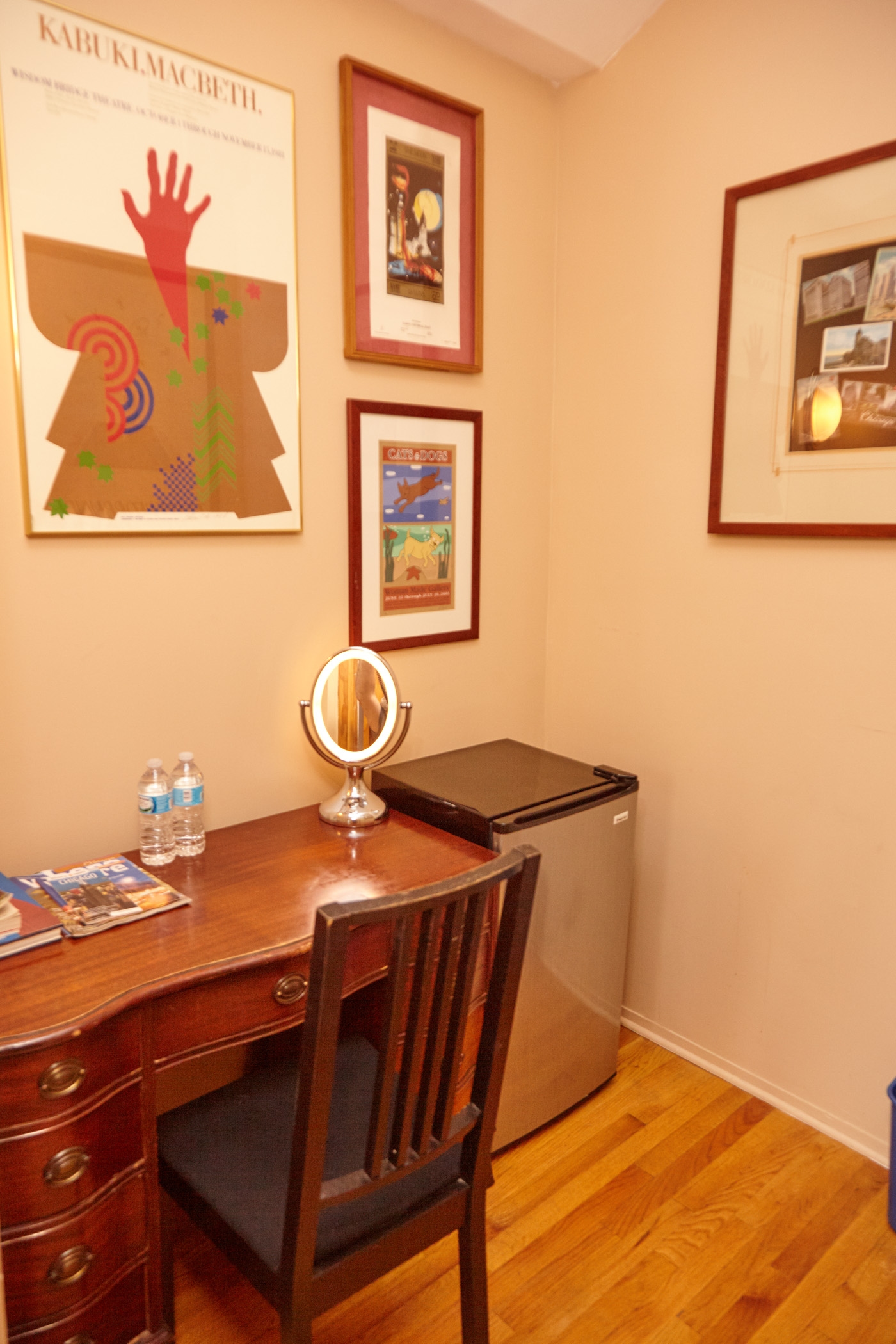 wooden desk & chairs with floor lamp, brown wall and white wall